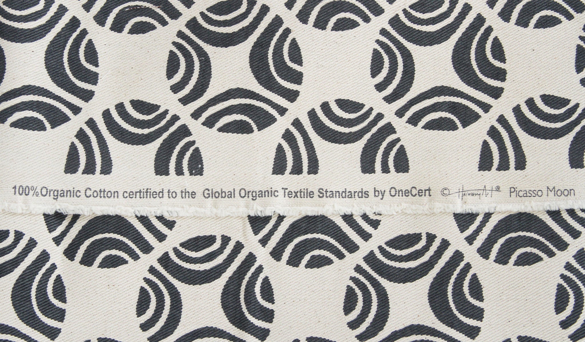 closeup of GOTS certified grey and natural organic fabric