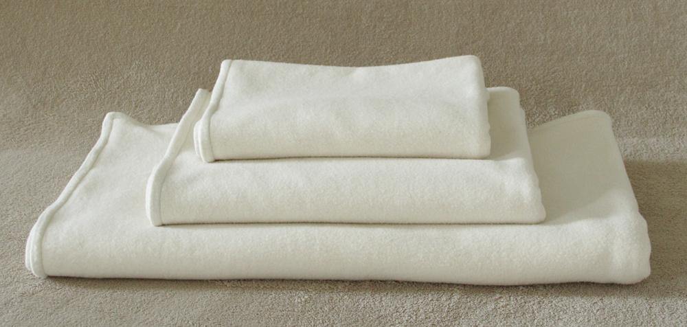 stack of organic cotton natural fleece dog blankets
