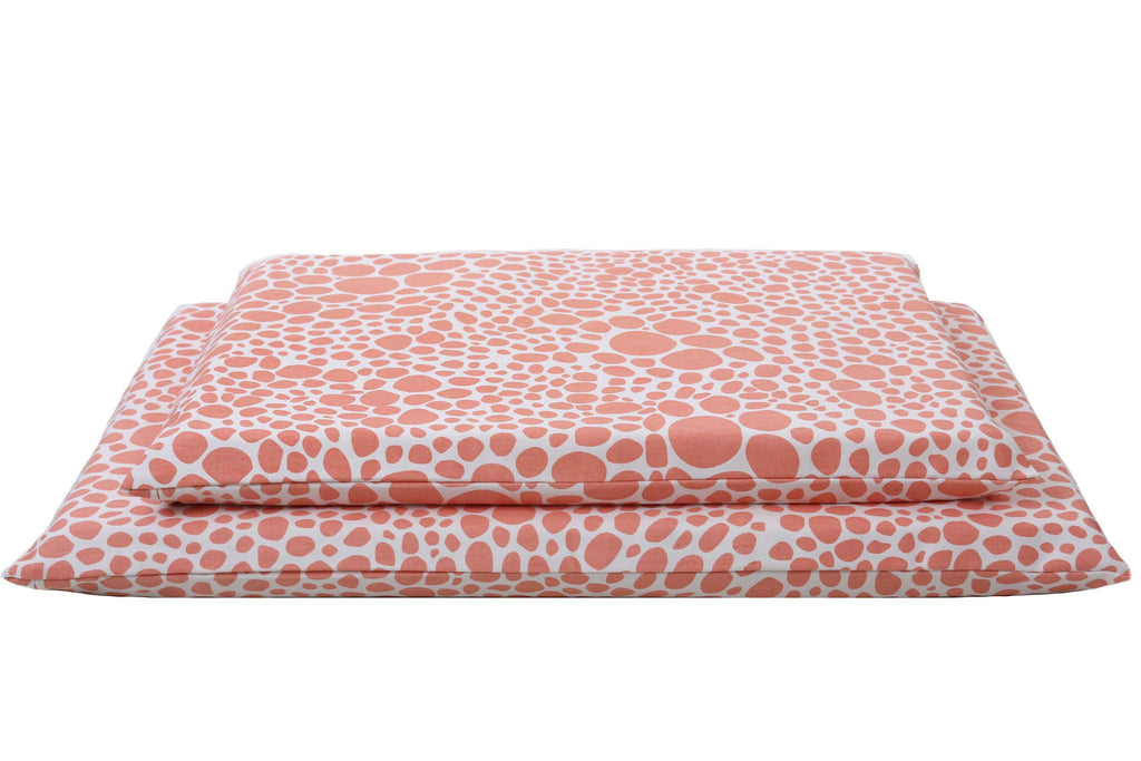 coral and white dog mat