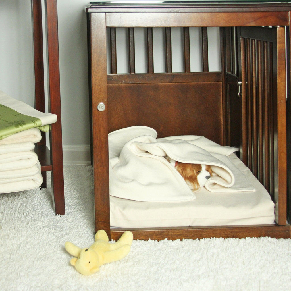 puppy sleeping on organic dog mat in crate